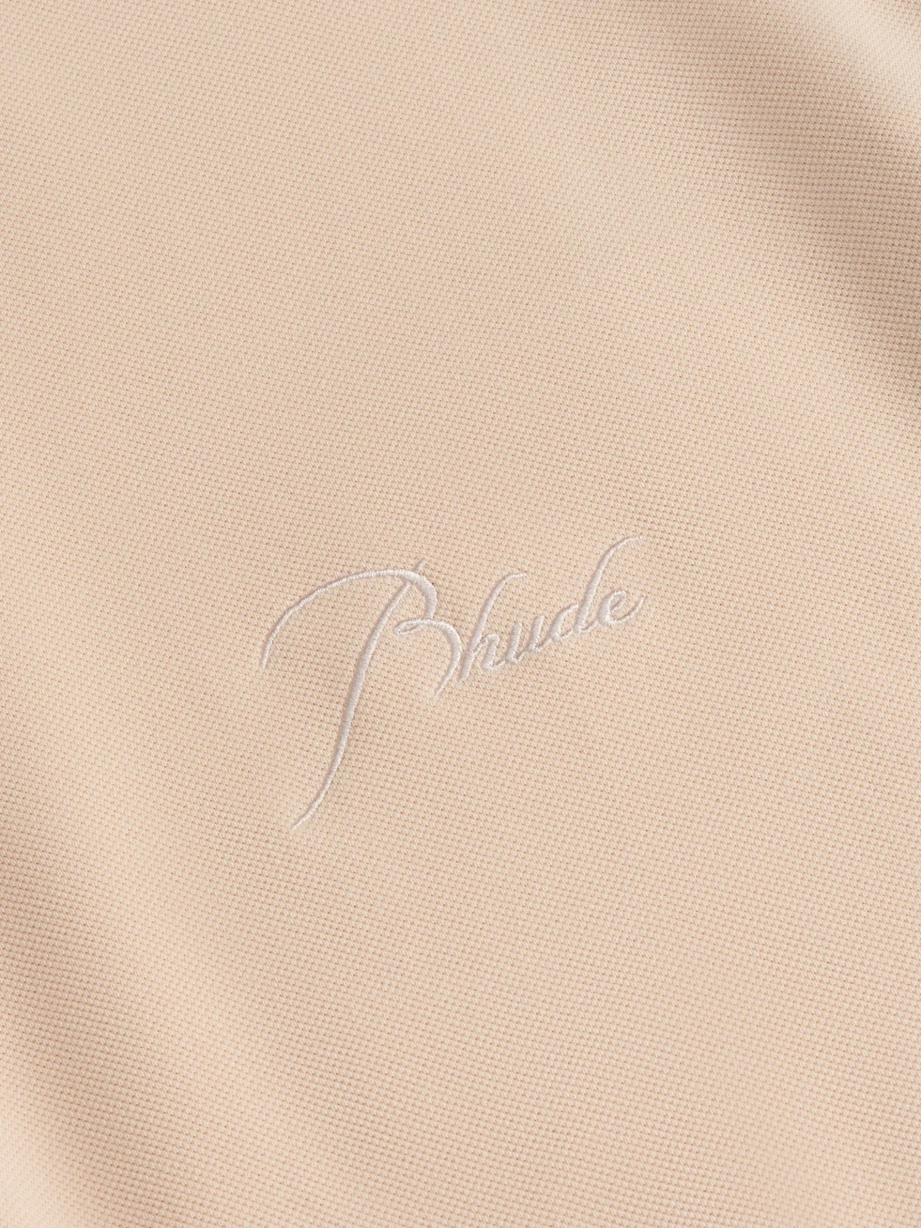 PIQUE SNAP SHORT SLEEVE POLO